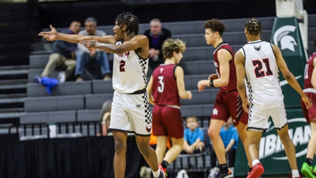 Detroit Old Redford's Kason Mayes points at the Riverview Gabriel Richard bench after a teammate makes a 3-pointer during the Michigan High School Athletic Association boys basketball Division 3 semifinals at Breslin Center in East Lansing on Thursday, March 14, 2024.